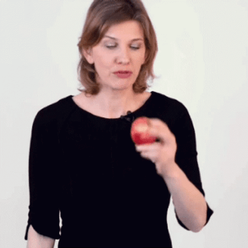 Serious Woman Biting An Apple