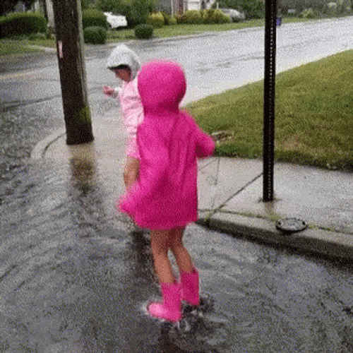 Kids Jumping In Rain Water