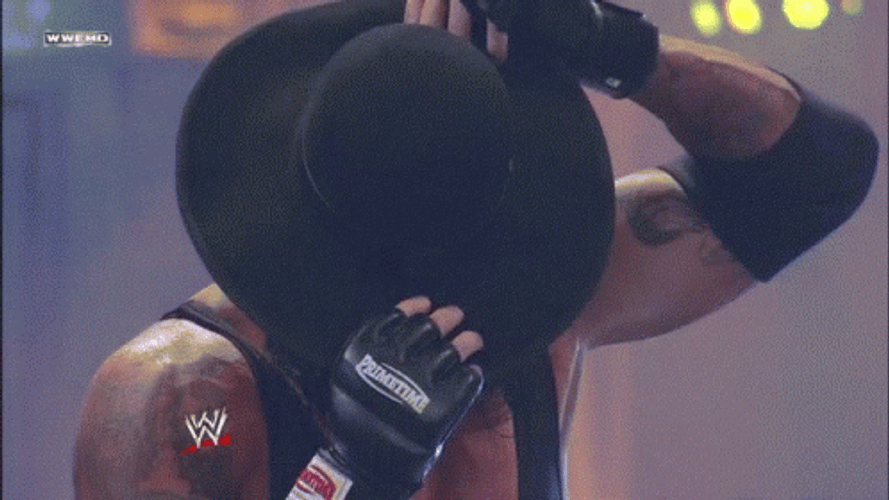 The Undertaker Removing Hat