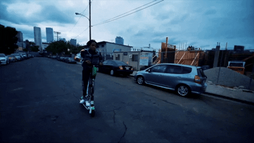Playboi Carti Riding Scooter