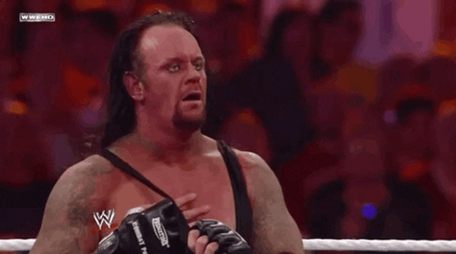 The Undertaker Removing His Shirt