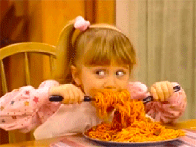 Little Girl Eating Pasta