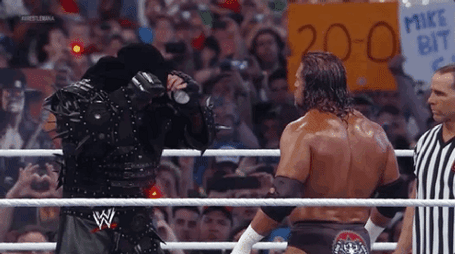 The Undertaker Removing His Bonnet