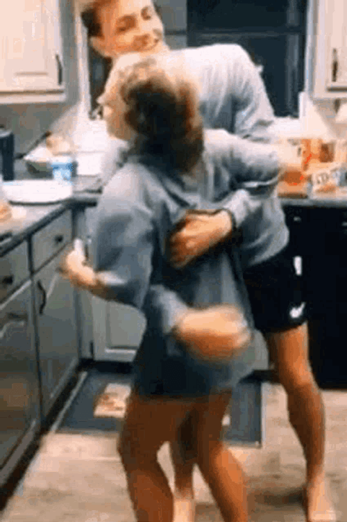 Couple Flirting In The Kitchen