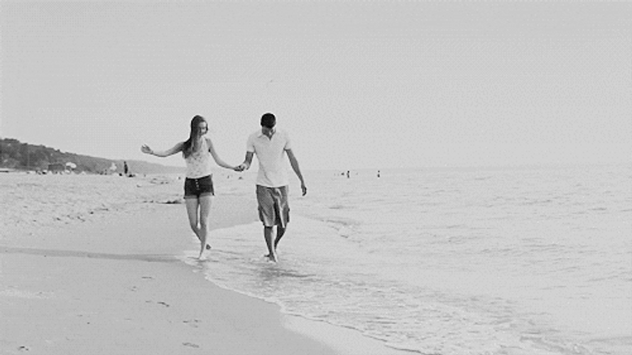 Cute Couples Walking On The Beach