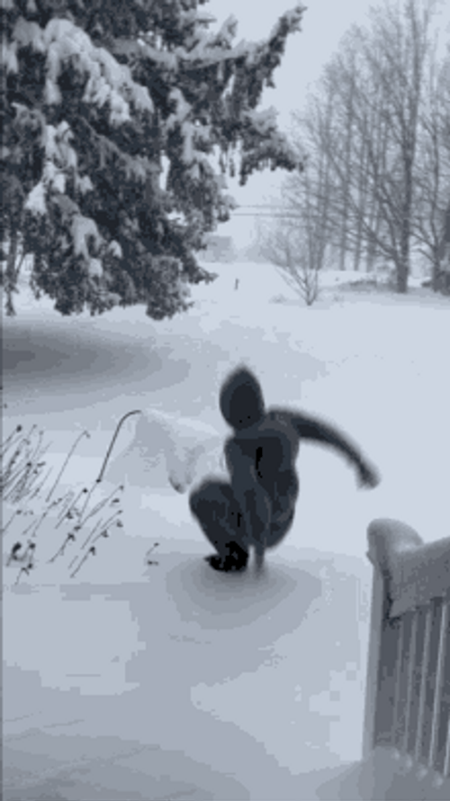 Kid Jumping In Snow
