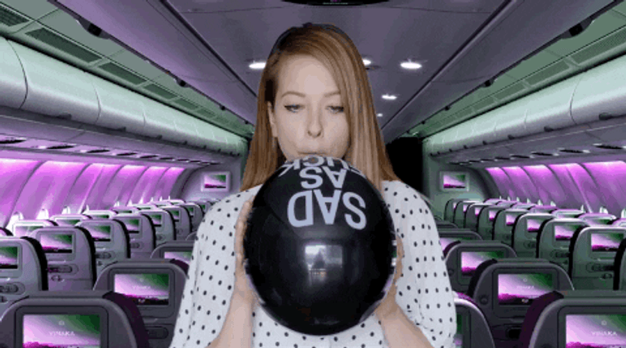 Lady Blowing Balloon