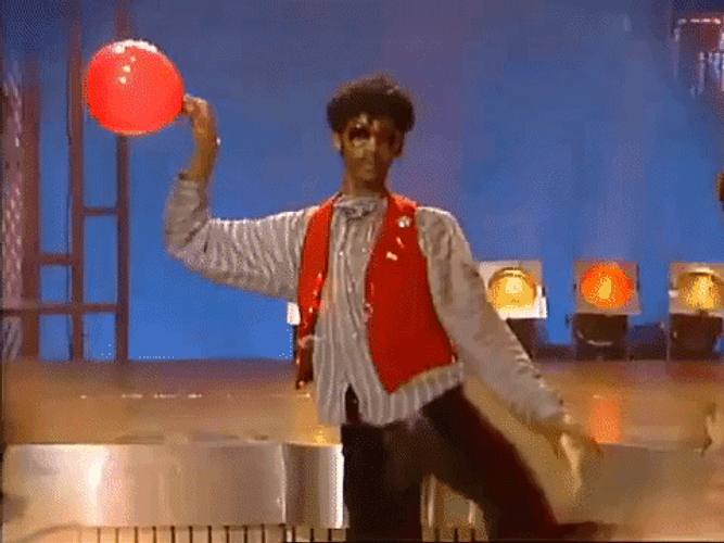 Man Dancing Holding Balloon