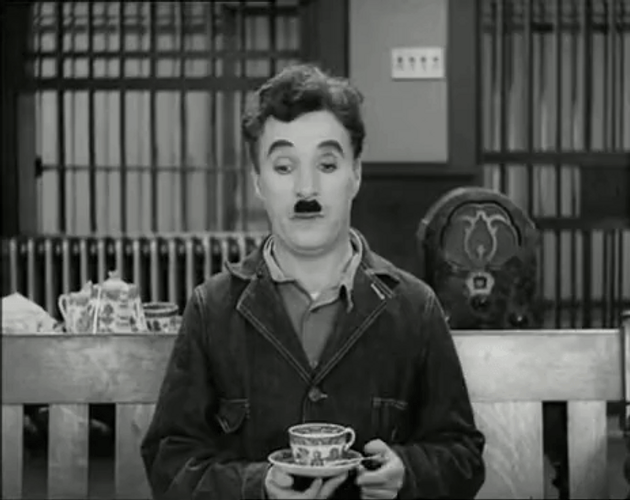Charlie Chaplin Drinking Coffee