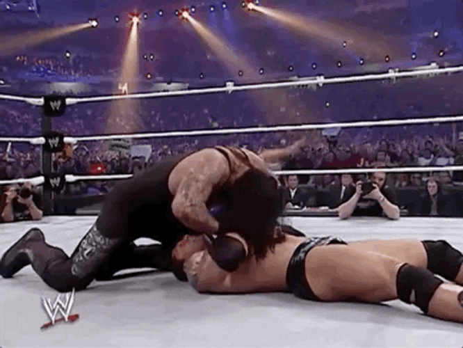 The Undertaker Pushing His Opponent Hands