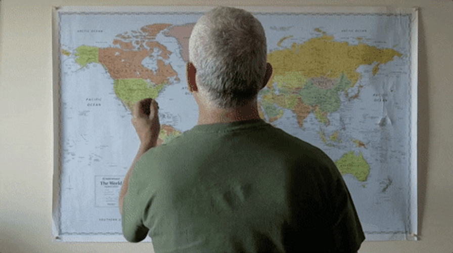 Man Pinning Travel Map